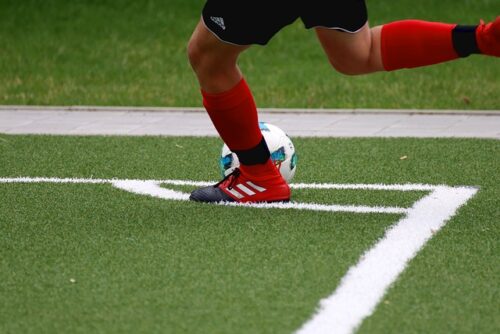 kicking a football